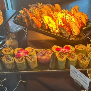 Steak Pin Wheel Wraps(bottom) &amp; Bacon wrapped Chicken stuffed with jalapeño poppers (top)