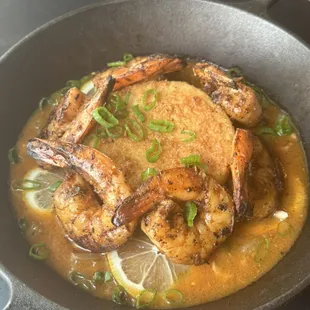 Blacken Gulf Shrimp served with a fried polenta cake in a cajun cream sauce (Shrimp &amp; Grits)