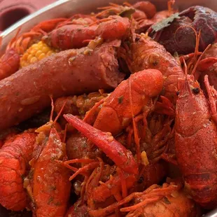 a bowl of crawfish and corn