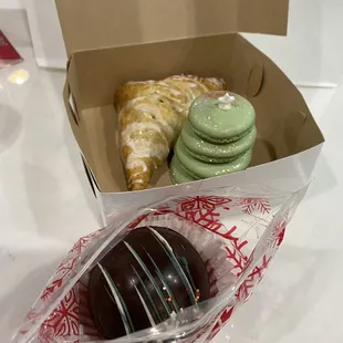 Hot cocoa bomb, apple turnover, and eggnog macaron tree