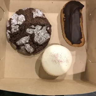 Delicious desserts a crackle cookie, peppermint macron and an eclair