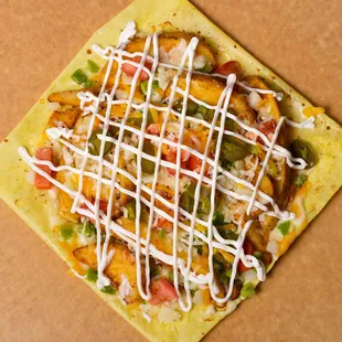 Loaded Potato Wedges:-

Seasoned Potato wedges, mozzarella, cheddar, green pepper, onion, tomato, jalapeno, hot sauce and sour cream.