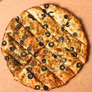 Zaatar Manakeesh Bread:- Zaatar Spice Mix, olive oil, black olives, mozzarella