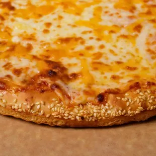 Three Cheese Pizza is topped with Mozarella,  Parmesan Cheese, Cheddar Cheese