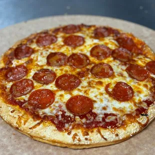 Ultimate Pizza With Pepperoni, Mozzarella Cheese, Zesty Pizza Sauce and Sesame seeds. So Much Pepperoni Saying It Once Is Once Isn't Enough!