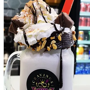 a milkshake with whipped cream and chocolate