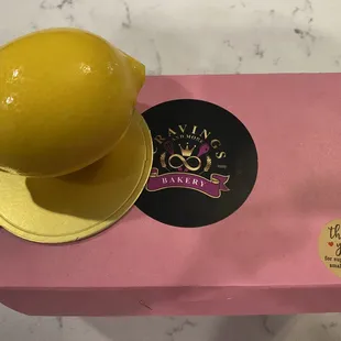 Lemon mousse pastry in a chocolate shell.