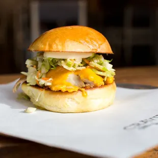 Cravings Club- roasted chicken, local cheddar, brussels sprout apple slaw, thick cut bacon and rosemary aioli on toasted housemade brioche