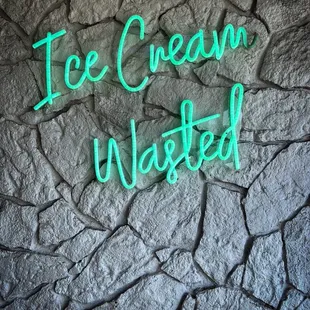 a neon sign that says ice cream wasted