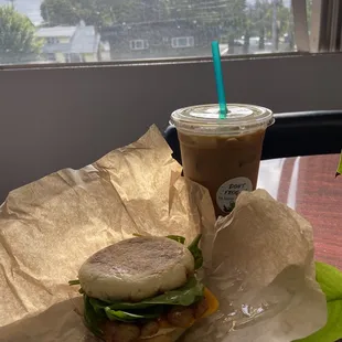 Sausage breakfast sandwich on an English muffin &amp; iced Hawaiian latte