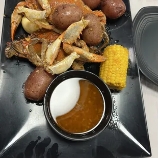 Vietnam Cajun Blue crab with potatoes, boiled egg, and corn