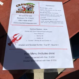 a menu on a picnic table