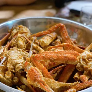 a bowl of crab legs