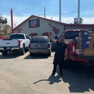 a man standing in front of a truck