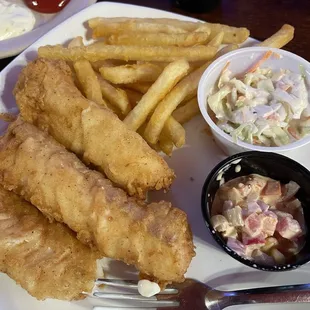 Large cod and fries with a tasty corn salad and coleslaw