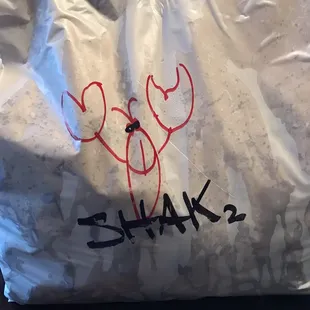 a bag with the word shak written on it