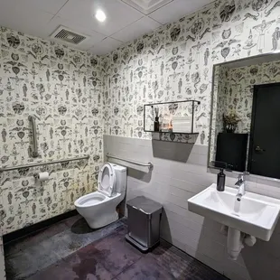 Inside one of the two unisex restrooms. Clean. Also, interesting wallpaper.