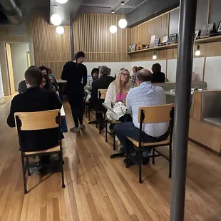 a group of people sitting at a table