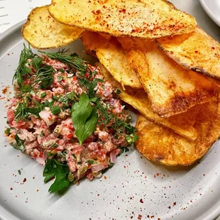 Crawford has perfected the tartare which cannot be missed. The homemade chips have a hint of salt &amp; vinegar which really kicks up the flavor