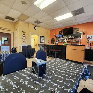 a view of the bar and dining area