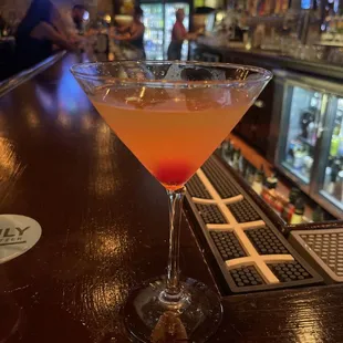 a cocktail in a martini glass