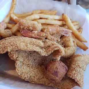 Combo catfish and shrimp basket. Fish, shrimp, and fries were delicious.  Hushpuppies were okay.