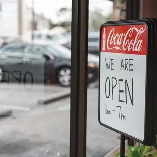 a sign in the window of a restaurant