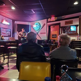 a man playing a guitar