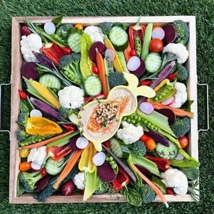 a variety of vegetables in a wooden box