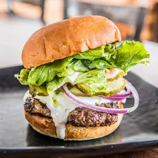 Santorini Burger is part beef and part lamb with a greek sauce that makes it yummy.