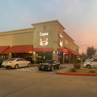 cars parked in front of a restaurant