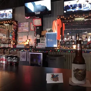 a beer and televisions