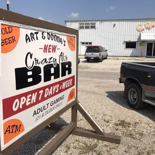 a sign in front of a building