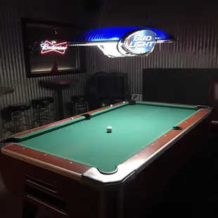 a pool table in a bar