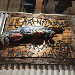 a dead fish on a sign