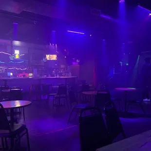 a bar with purple lighting