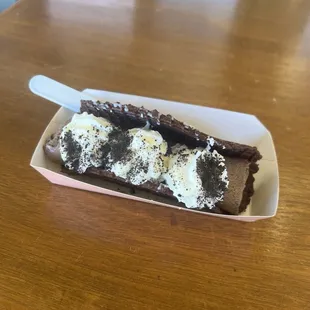 Ice Cream Roll Taco (Chocolate Ice Cream + Oreo Pieces + Gansito)  Whipped Cream and Oreo Crumbles on top