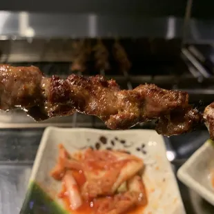 a skewer of meat on a stick