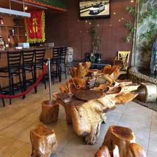 a table made out of tree stumps
