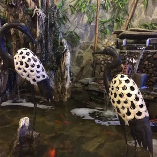 a pair of flamingos in a pond