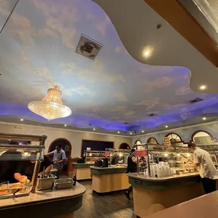 a man serving food in a restaurant