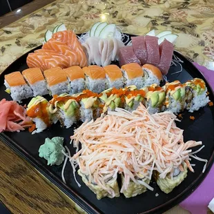 Tuna salmon and yellowtail sashimi and three specialty rolls