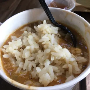 a bowl of cajuns and rice