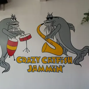 two fish playing instruments