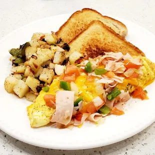 Omelet with breakfast potatoes and toast.