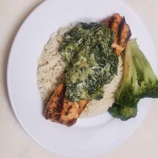 Crazy Coffee Cafe Salmon Florentine on a bed of rice with a side of broccoli.