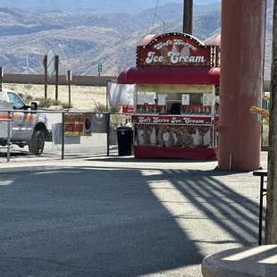 Ice Cream stand in parking lot, too.