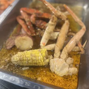 crab legs and corn on the cob