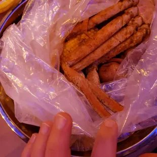 a person grabbing a piece of food