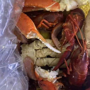 Lobster, crab legs, crawfish, egg, corn and potatoes. Lemon pepper and garlic butter.